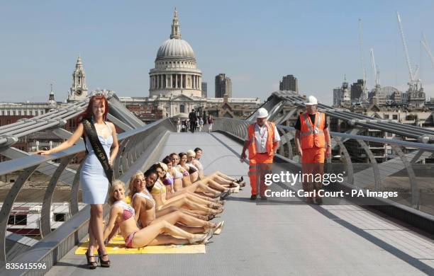 Miss Universe Great Britain Clair Cooper poses with models on the Millennium Bridge, London, ahead of the Miss Universe 2009 finals in The Bahamas.