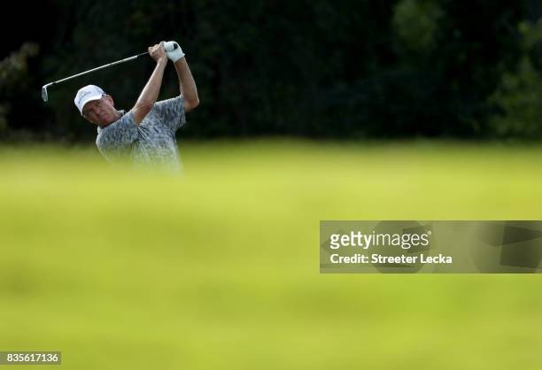 Davis Love III hits a tee shot on the 16th hole during the third round of the Wyndham Championship at Sedgefield Country Club on August 19, 2017 in...