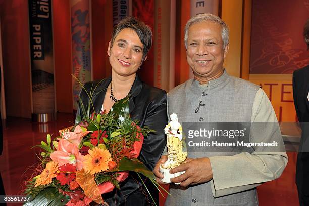 Monika Hauser and Peace Nobel prize winner Muhammad Yunus are seen with the Corine Award 2008 at the Prinzregententheater on November 4, 2008 in...