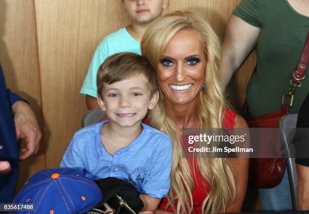 Dana Warrior poses with a wish kid at the WWE Superstars Surprise Make-A-Wish Families at One World Observatory on August 19, 2017 in New York City.