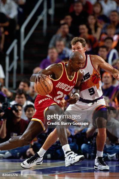 Clyde Drexler of the Houston Rockets drives the ball against Dan ...