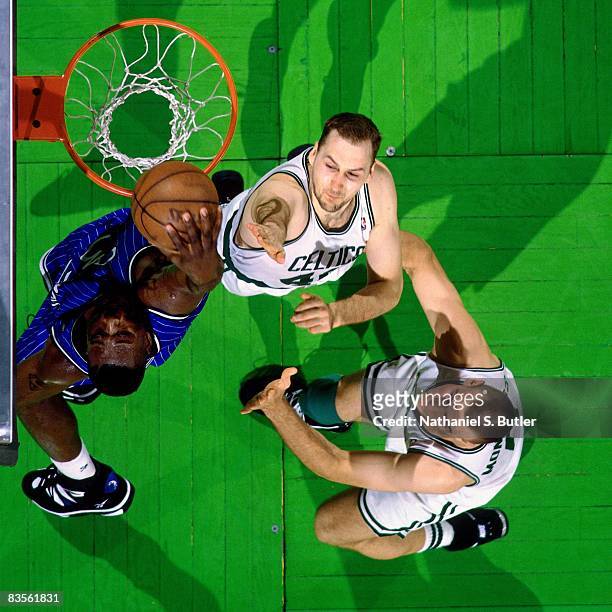 Shaquille O'Neal of the Orlando Magic dunks against Dino Radja of the Boston Celtics in Game Four of the 1995 NBA Eastern Conference Quarterfinals at...