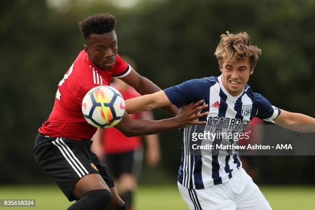 Ethan Laird of Manchester United and Jack McCourt of West Bromwich Albion during the U18 Premier League match between West Bromwich Albion and...