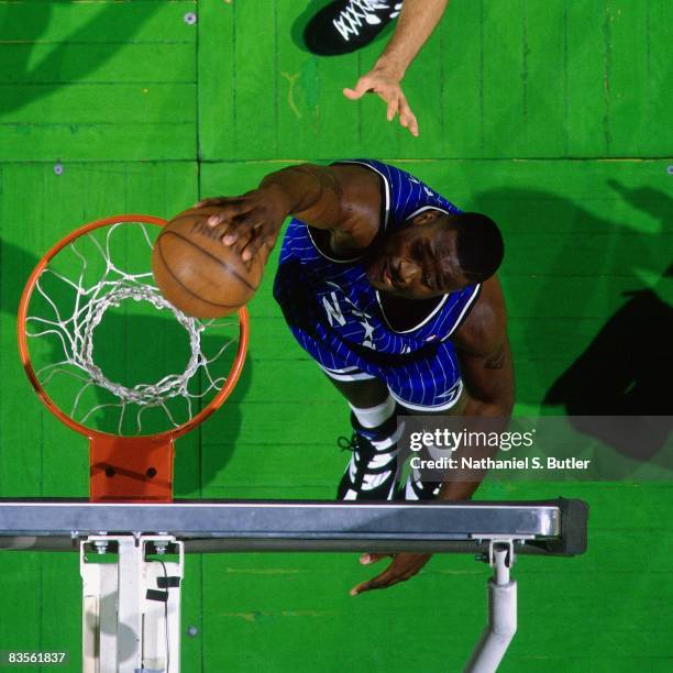 Shaquille O'Neal of the Orlando Magic dunks in Game Four of the 1995 NBA Eastern Conference Quarterfinals against the Boston Celtics at Boston Garden...