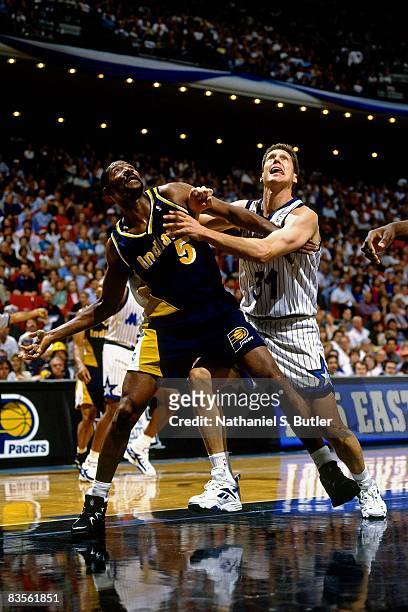 Jeff Turner of the Orlando Magic battles for position against Sam Mitchell of the Indiana Pacers in Game One of the 1995 NBA Eastern Conference...