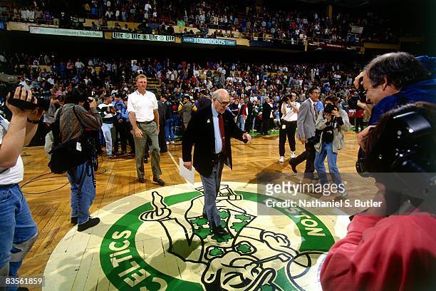 Red Auerbach and NBA Legend Larry Bird walk to center court prior to Game Four of the 1995 NBA Eastern Conference Quarterfinals between the Orlando...