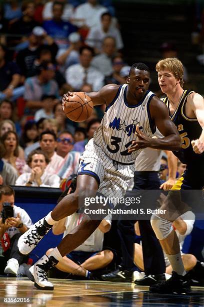 Shaquille O'Neal of the Orlando Magic posts up against Rick Smits of the Indiana Pacers in Game One of the 1995 NBA Eastern Conference Finals at the...