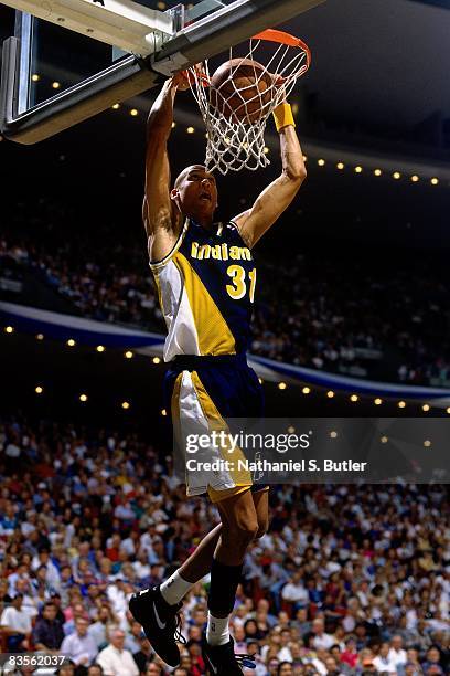 Reggie Miller of the Indiana Pacers dunks in Game One of the 1995 NBA Eastern Conference Finals against the Orlando Magic at the Orlando Arena on May...