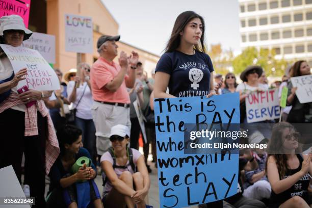 Aanchal Chugh, of Sunnyvale, holds a sign promoting the role of women in tech at a rally against white nationalism on August 19, 2017 in Mountain...