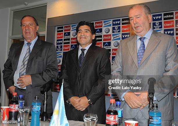 Carlos Bilardo, Diego Maradona and Julio Grondona pose for photographers at the presentation of Diego Maradona as new Argentina's football coach, at...