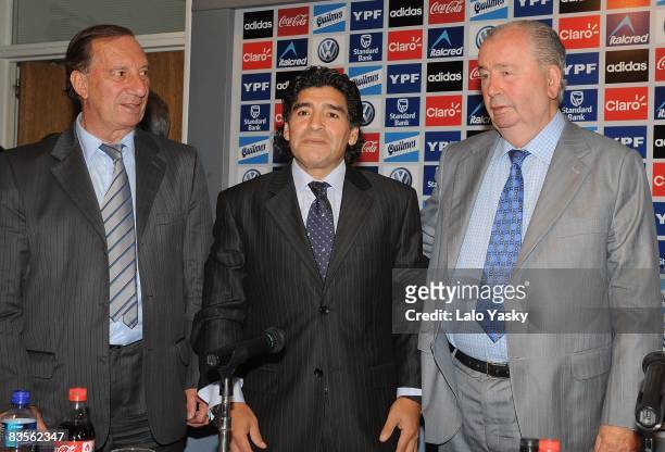 Carlos Bilardo, Diego Maradona and Argentinian Football Asociation president Julio Grondona pose for photographers at the presentation of Diego...