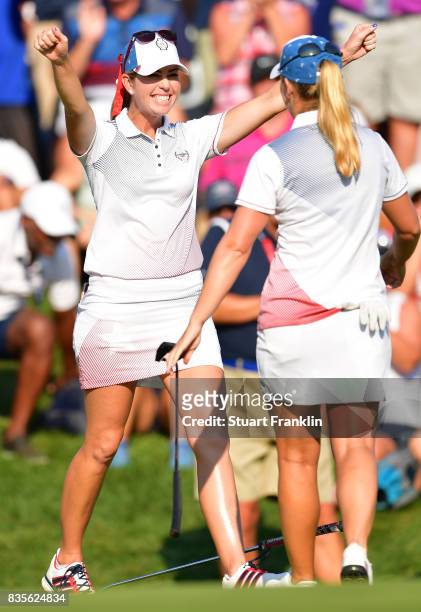 Paula Creamer and Austin Ernst of Team USA celebrates their win during the second day afternoon fourball matches of The Solheim Cup at Des Moines...