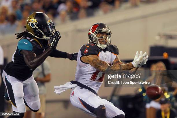 Mike Evans of the Buccaneers has a touchdown toss drop thru his hands as Brian Dixon of the Jaguars defends on the play during the NFL Preseason game...