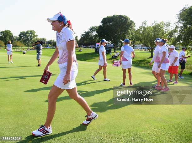 Paula Creamer of Team USA reacts to a two and one win over Team Europe during the evening four-ball matches of the Solheim Cup at the Des Moines Golf...