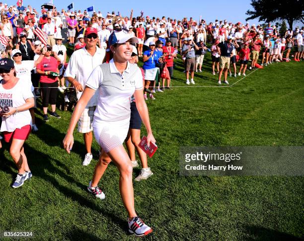 Paula Creamer of Team USA reacts to a two and one win over Team Europe during the evening four-ball matches of the Solheim Cup at the Des Moines Golf...