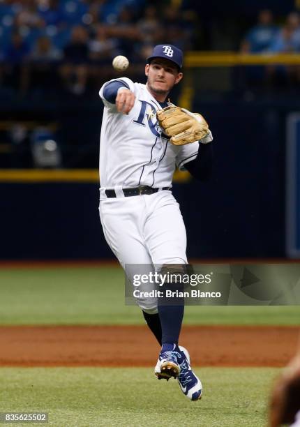 Second baseman Daniel Robertson of the Tampa Bay Rays fields the single by Robinson Cano of the Seattle Mariners during the third inning of a game on...