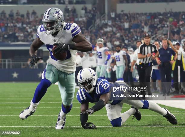 Dez Bryant of the Dallas Cowboys breaks away from Vontae Davis of the Indianapolis Colts on a touchdown run against the Indianapolis Colts in the...