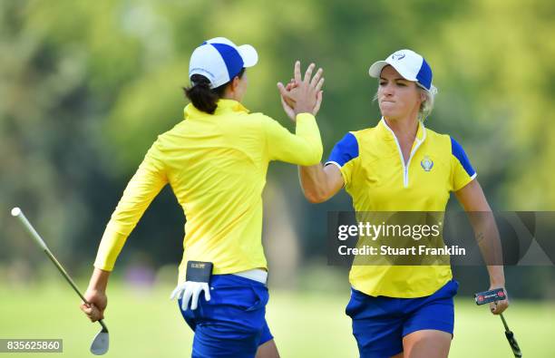 Mel Reid of Team Europe celebrates with Carlota Ciganda during the second day afternoon fourball matches of The Solheim Cup at Des Moines Golf and...