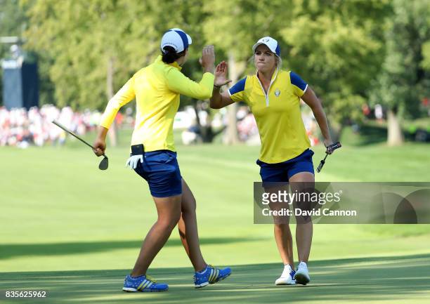 Melissa Reid of England and the European Team celebrates after she holed a birdie putt at the 16th hole with her parner Carlota Ciganda of Spain in...