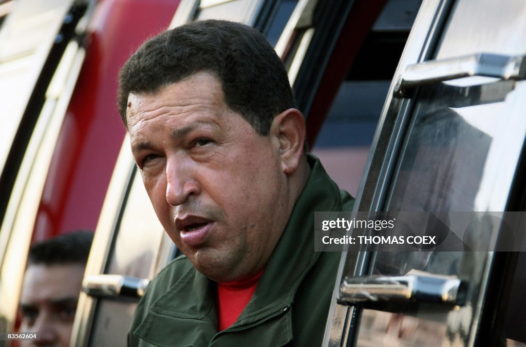 Venezuela's President Hugo Chavez gestur