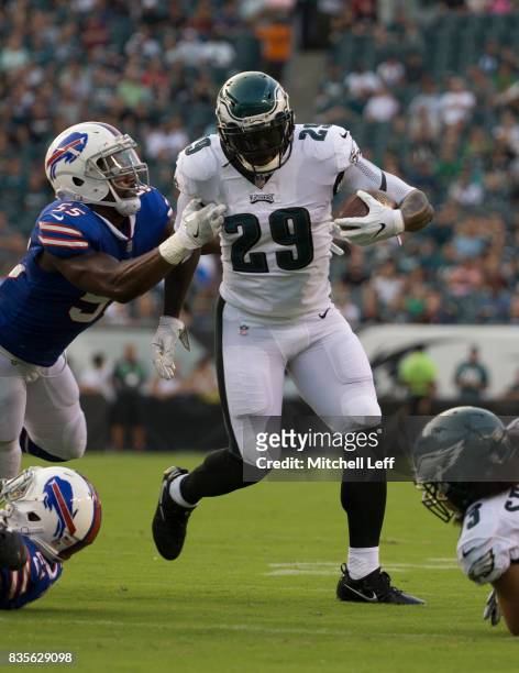 LeGarrette Blount of the Philadelphia Eagles runs the ball against Jerry Hughes of the Buffalo Bills in the preseason game at Lincoln Financial Field...