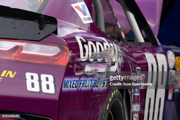 Paint is scraped off the side of the Dale Earnhardt Jr Hendrick Motorsports Chevrolet SS during practice for the Food City 300 on August 17 at the...