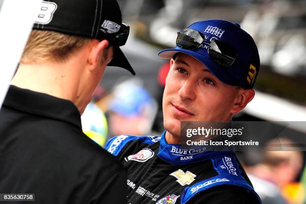 Daniel Hemric Richard Childress Racing Chevrolet Camaro talks with John-Hunter Nemecheck before the start of practice for the Food City 300 on August...