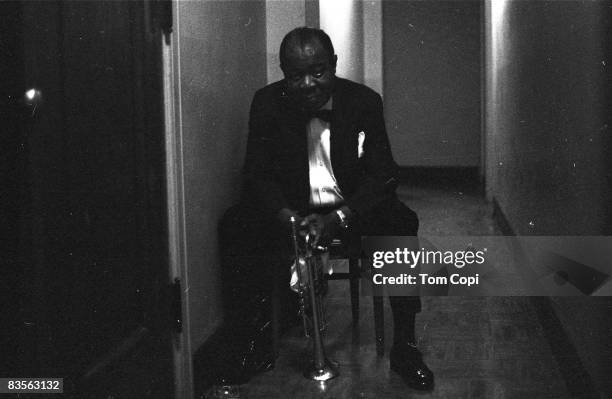 Jazz trumpeter Louis Armstrong backstage at the University of Michigan on September 2, 1967 in Ann Arbor, Michigan.