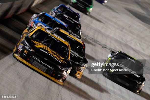 Brendan Gaughan Richard Childress Racing Chevrolet Camaro leads a pack of cars down the front stretch during the Food City 300 on August 18 at the...