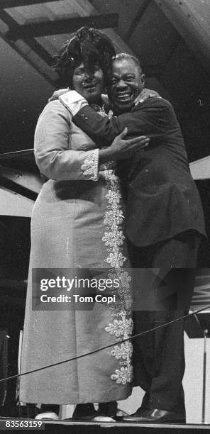 Jazz trumpeter Louis Armstrong performs with Gospel singer Mahalia Jackson at the Newport Jazz Festival On July 10, 1970 at Festival Field in...