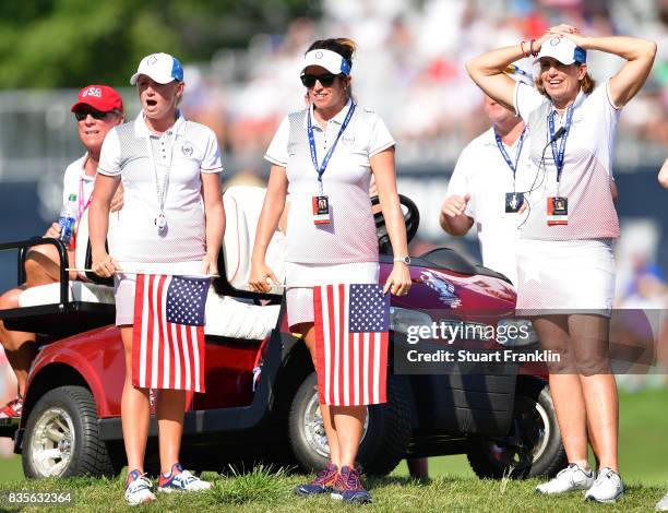 Stacy Lewis, Gerina Piller and Captain Juli Inkster of Team USA support their team during the second day afternoon fourball matches of The Solheim...