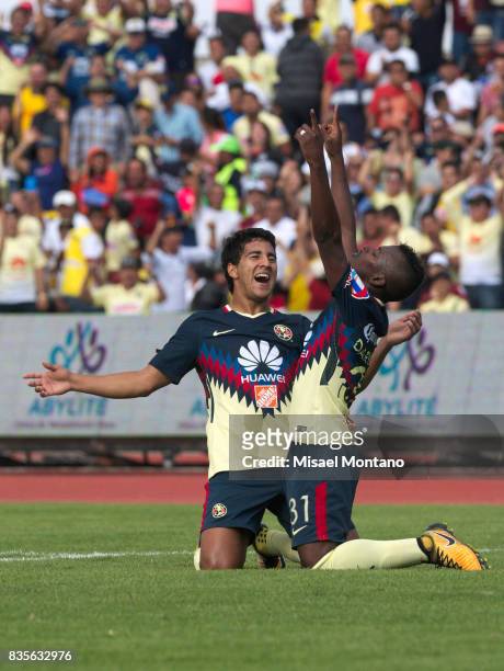 Darwin Quintero of America, celebrates with teammate Cecilio Dominguez after scoring the second goal of his team during the fifth round match between...