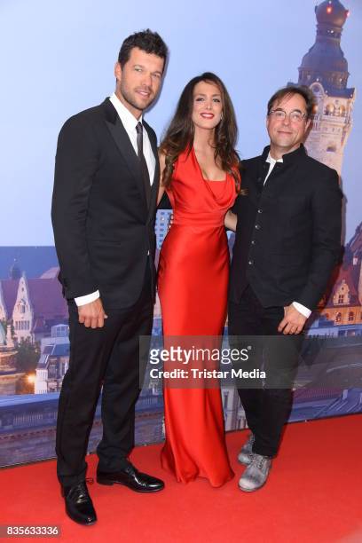 Michael Ballack, his girlfriend Natacha Tannous and Jan Josef Liefers attend the GRK Golf Charity Masters evening gala on August 19, 2017 in Leipzig,...