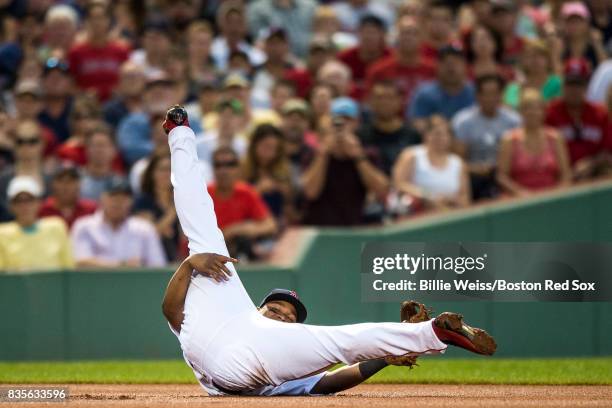 Rafael Devers of the Boston Red Sox reacts after making a diving stop during the inning of a game against the New York Yankees on August 19, 2017 at...