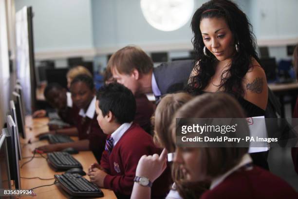 Singer and reality TV star Mutya Buena talks to pupils at Langdon School in East London, about the importance of financial education for the launch...