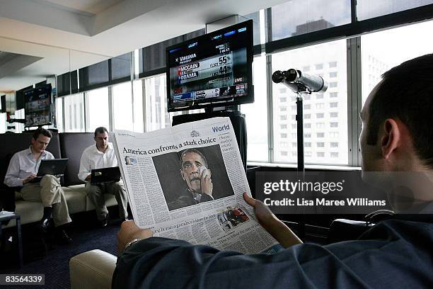 Man reads a newspaper article about the American election at the US Election Watch 2008 event held at The American Club on November 5, 2008 in...