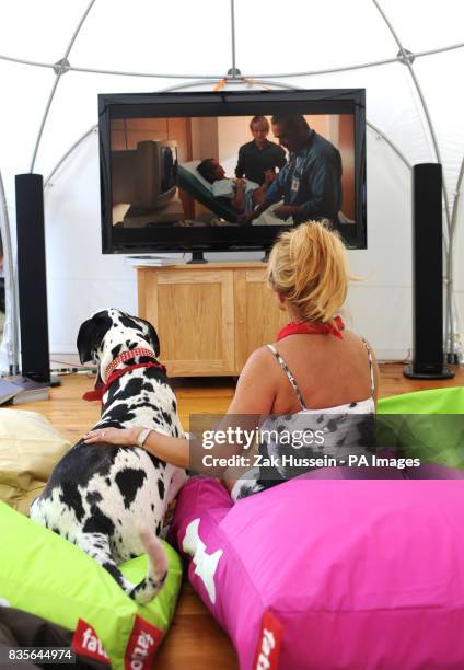 Jilly Johnson and her dog Boris watch the film Marley and Me during the Macmillan Dog Day 2009 at the Royal Chelsea Hospital in south west London.