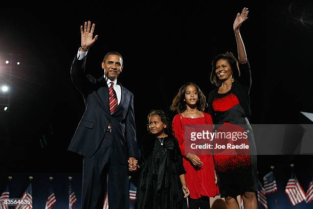 President elect Barack Obama acknowledges his supports along with his wife Michelle and daughters Malia and Sasha to during an election night...