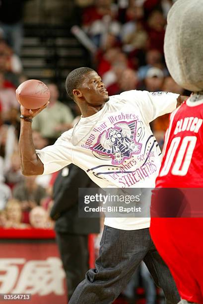 Andre Johnson of the Houston Texans throws an autographed football into the crowd on November 4, 2008 at the Toyota Center in Houston, Texas. NOTE TO...