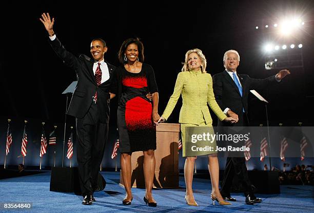 President elect Barack Obama and his wife Michelle wave to their supporters along with Vice-President elect Joe Biden and his wife Jill after Obama...