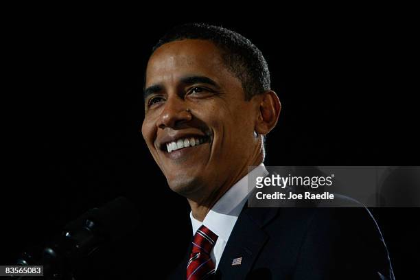 President elect Barack Obama smiles as he gives his victory speech to supporters during an election night gathering in Grant Park on November 4, 2008...