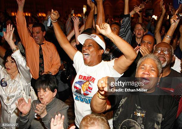 David Hudzick, Joanne Scott and Mercedes Foster of Nevada react at the Nevada Democratic Party's election results watch party at the Rio Hotel &...