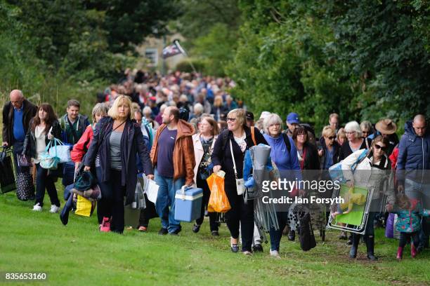 Thousands of spectators arrive as they attend the annual Castle Howard Proms Spectacular concert held on the grounds of the Castle Howard estate on...