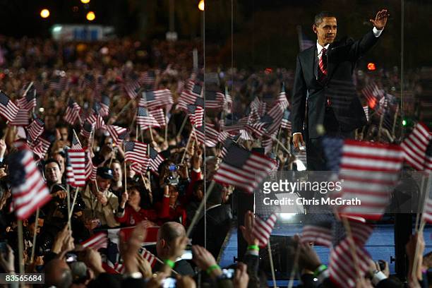 President elect Barack Obama gestures on stage during an election night gathering in Grant Park on November 4, 2008 in Chicago, Illinois. Obama...
