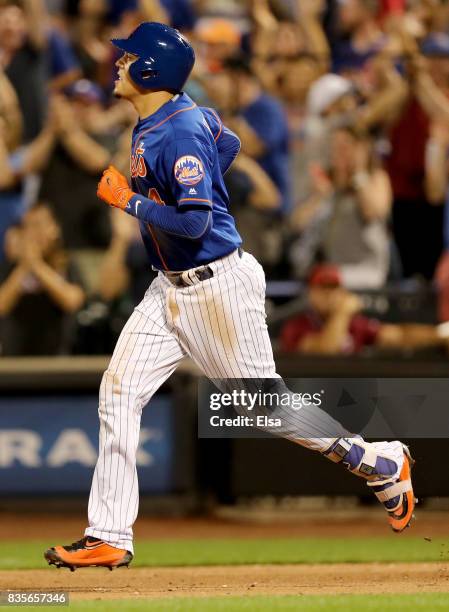 Wilmer Flores of the New York Mets rounds the bases after his two run home run in the sixth inning against the Miami Marlins on August 19, 2017 at...