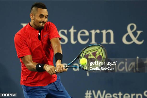 Nick Kyrgios of Australia returns a shot to David Ferrer of Spain during Day 8 of the Western and Southern Open at the Linder Family Tennis Center on...