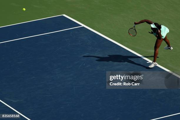 Sloane Stephens serves to Simona Halep of Romania during Day 8 of the Western and Southern Open at the Linder Family Tennis Center on August 19, 2017...