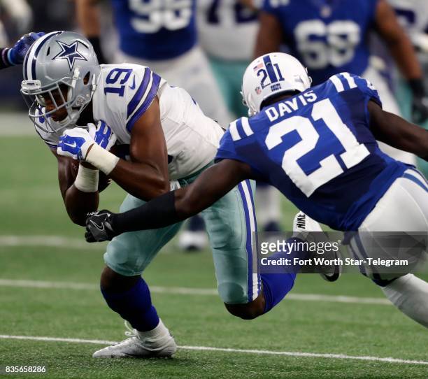 Dallas Cowboys wide receiver Corey Washington attempts to avoid Indianapolis Colts cornerback Vontae Davis during the first half at AT&T Stadium in...