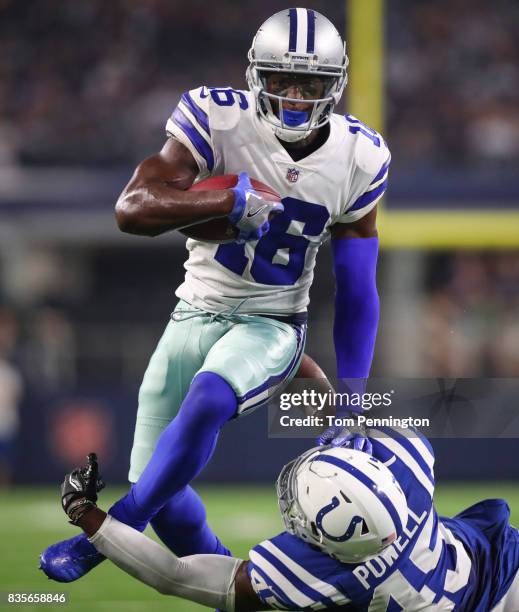 Nwachukwu of the Dallas Cowboys leaps over Tyvis Powell of the Indianapolis Colts on a carry in the 4th quarter of a preseason game at AT&T Stadium...