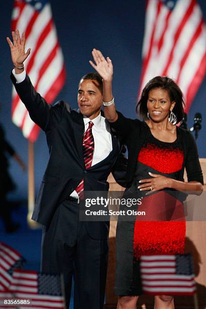 President elect Barack Obama and his wife Michelle wave to their supporters after Obama gave his victory speech during an election night gathering in...